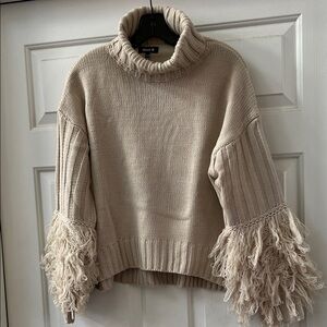 Elegant Cream Turtleneck Sweater with Fringe